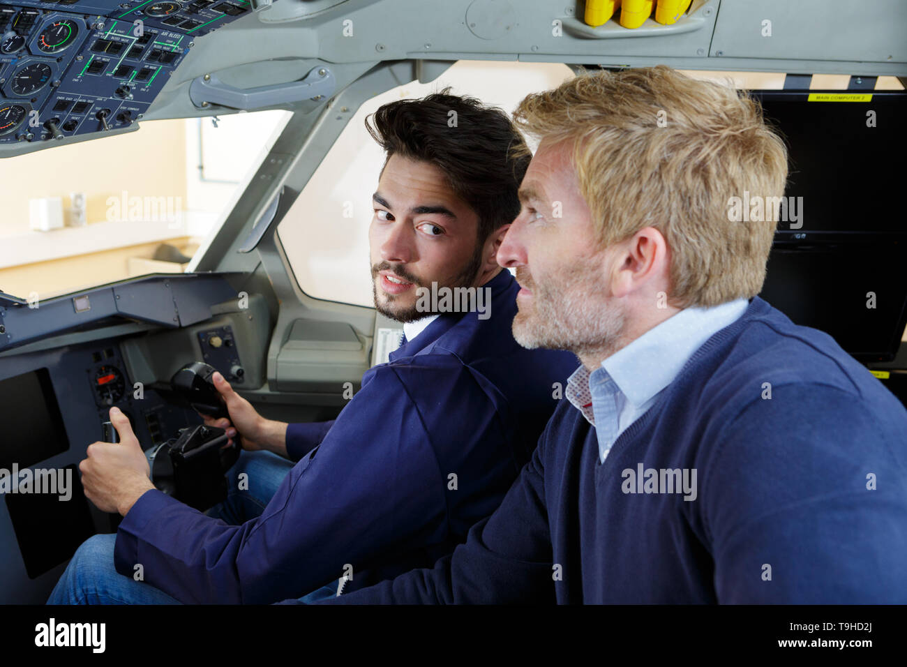 happy pilot apprentice talking to manager Stock Photo