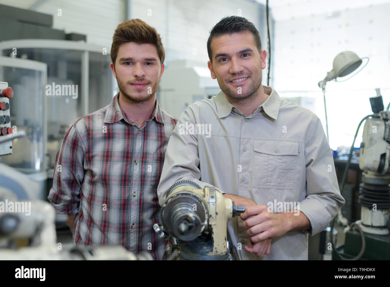 teacher and apprentice in a workshop Stock Photo
