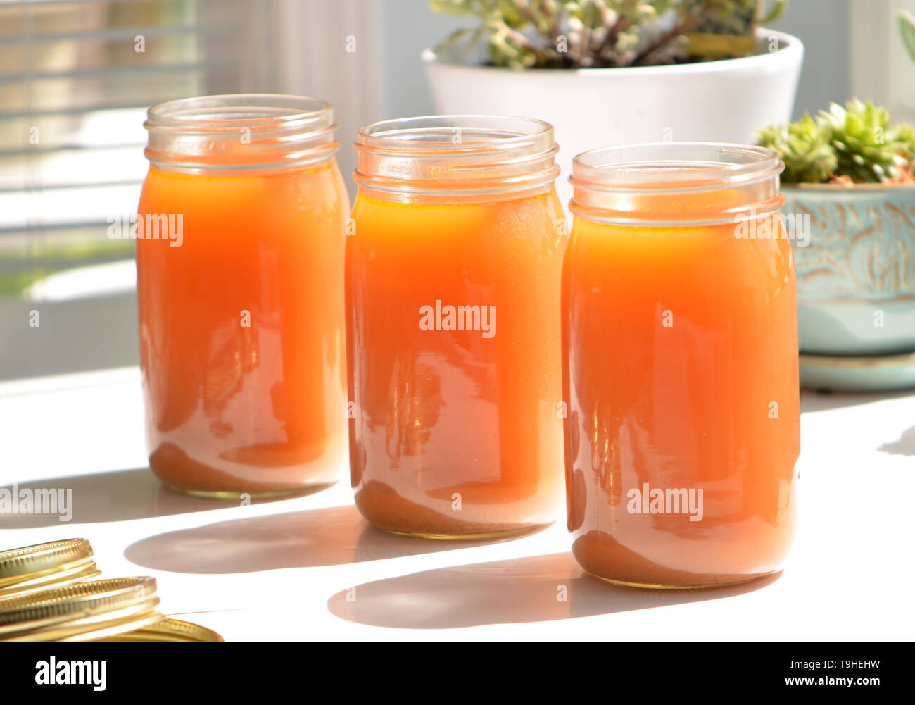 Homemade golden vegetable and chicken bone broth full of nutrition and