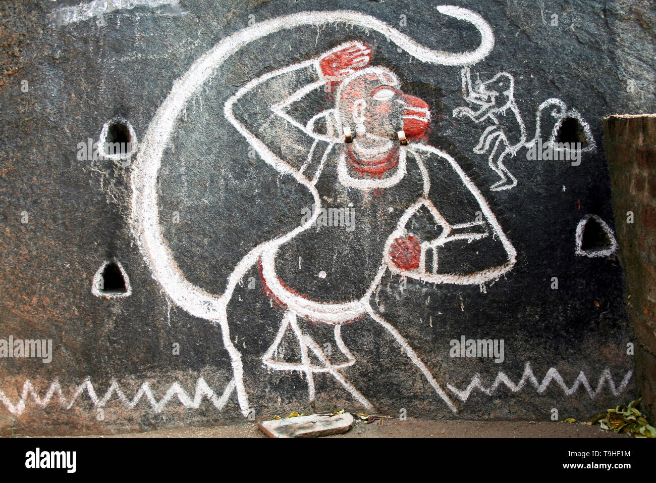 Sketch of Anjaneya, the Monkey God, etched and painted on rock Stock Photo