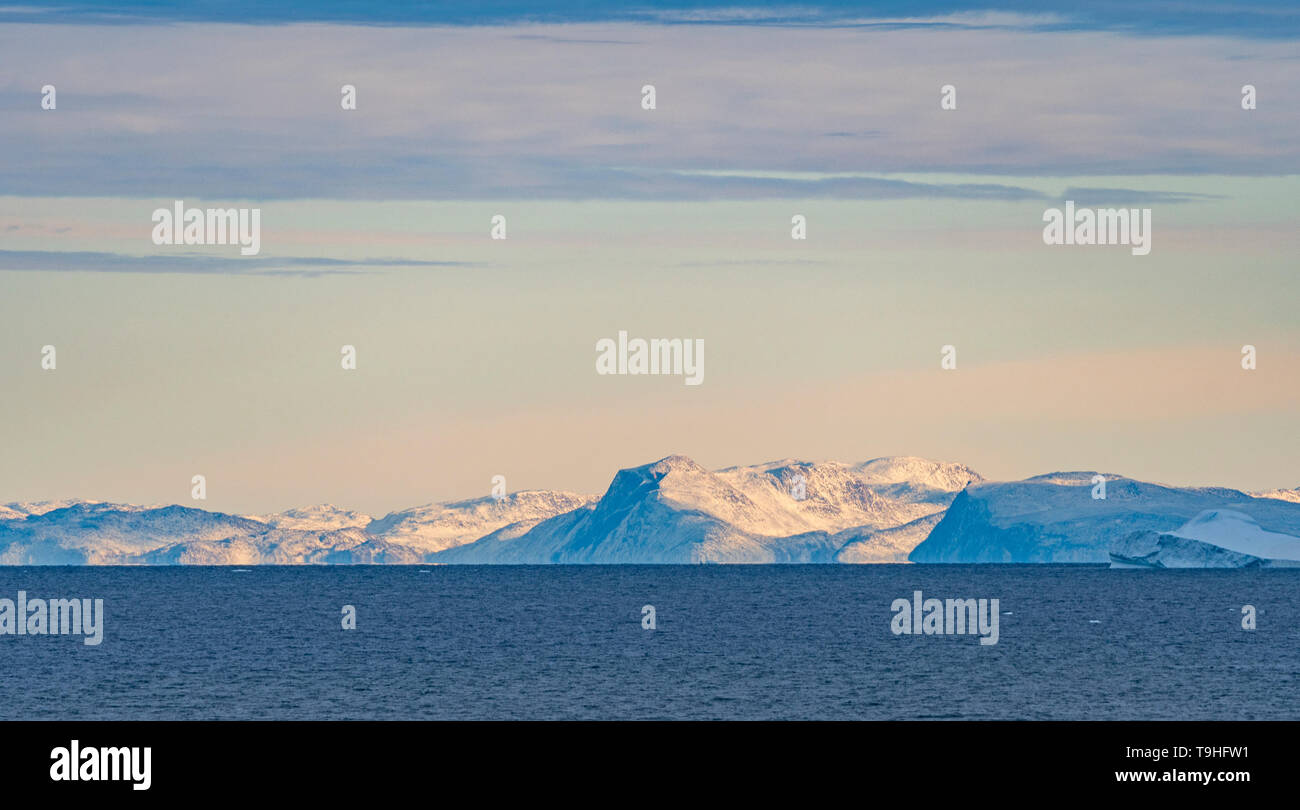 Clear Skies over Distant Peaks in the Vaigat Channel in Western Greenland Stock Photo