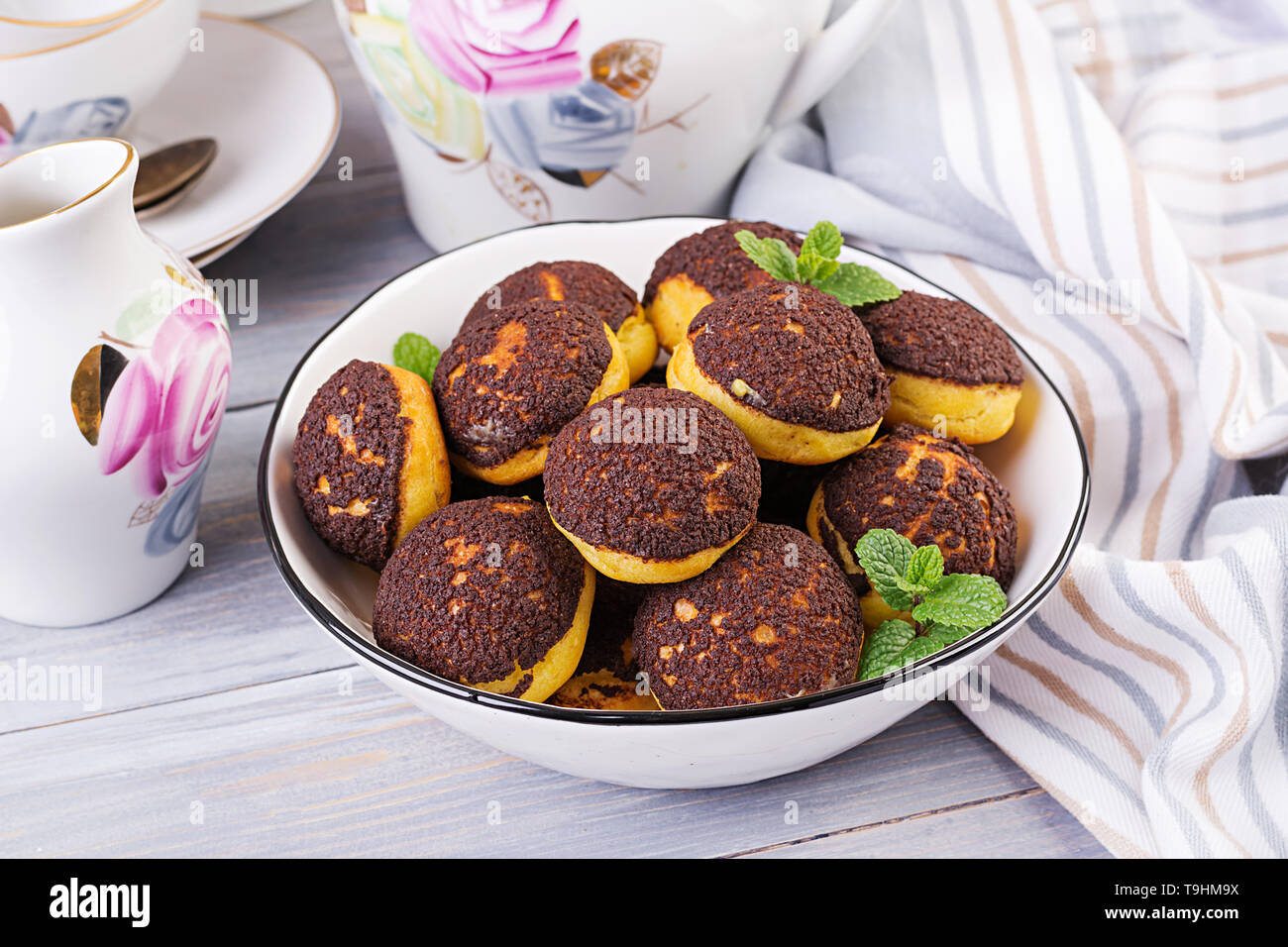 Shu Cake. Tasty profiterole with cream on the plate. Copy space Stock Photo