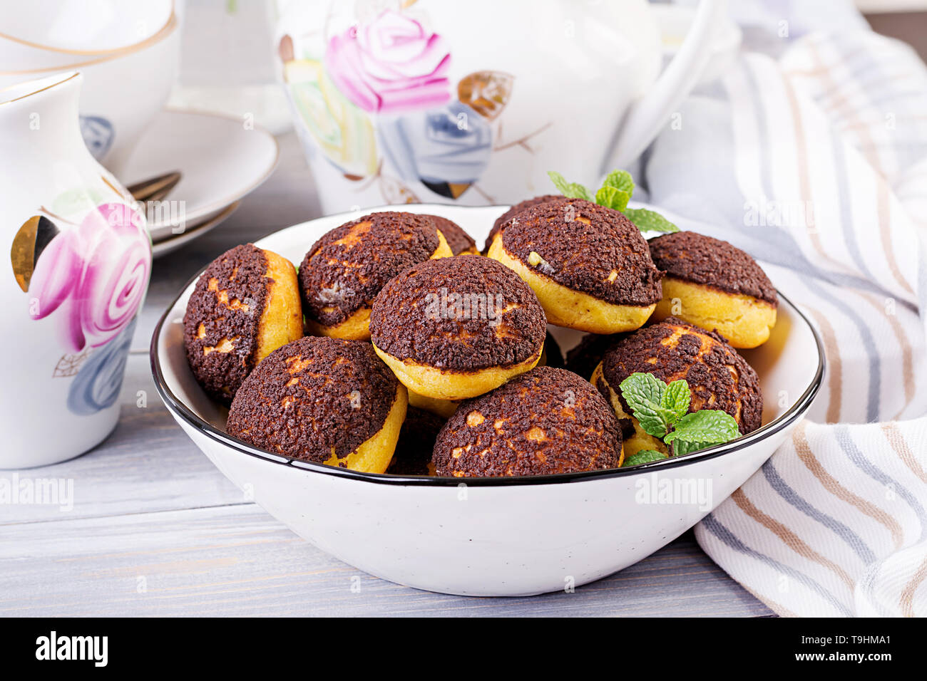 Shu Cake. Tasty profiterole with cream on the plate. Copy space Stock Photo