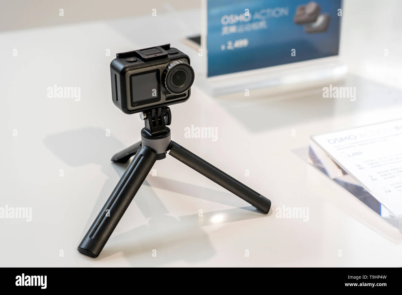 CHINA, SHANGHAI - MAY 18, 2019. DJI OSMO ACTION IN PROTECTED CASE AND TRIPOD OR SELFIE STICK. Stock Photo