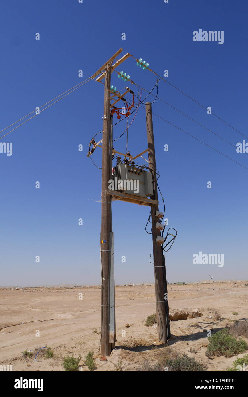 Telegraph pole in the desert, Kingdom of Bahrain Stock Photo
