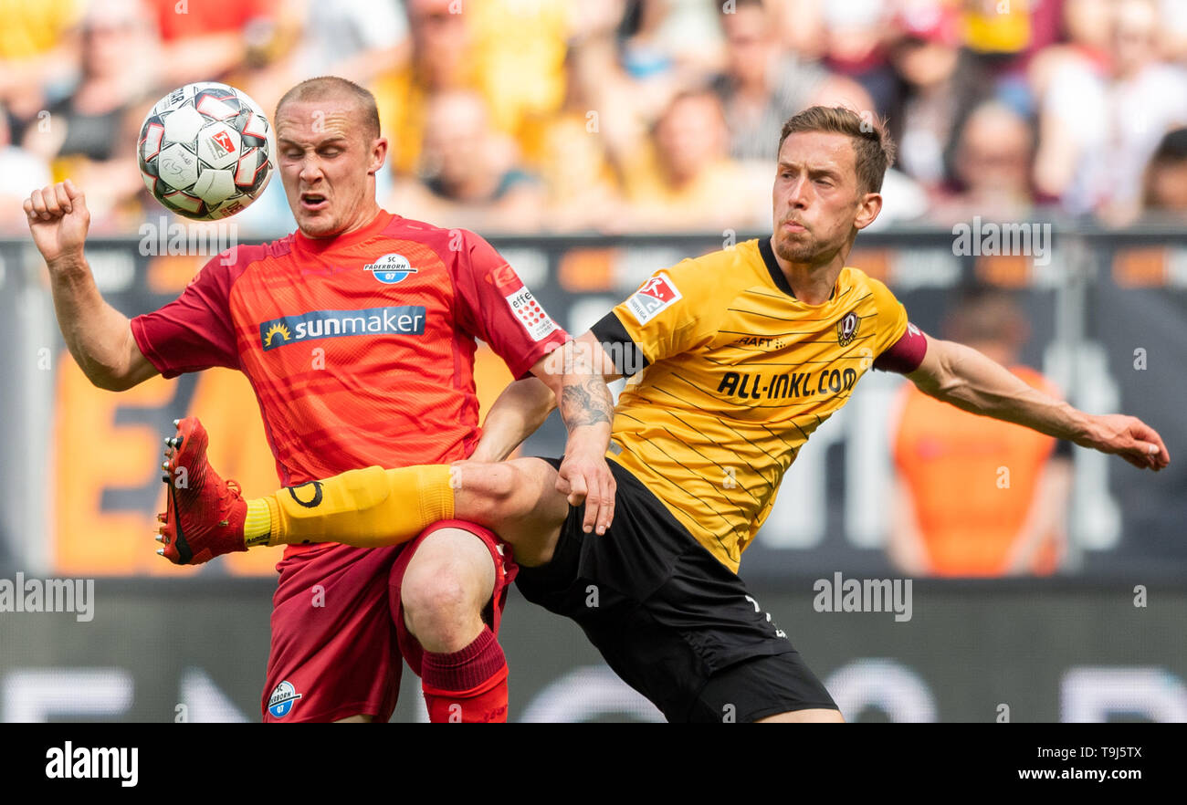 Dresden, Germany. 19th May, 2019. Soccer: 2nd Bundesliga, Dynamo Dresden - SC Paderborn 07, 34th matchday, in the Rudolf Harbig Stadium. Paderborn's Sven Michel (l) against Dynamos Jannik Müller. Credit: Robert Michael/dpa-Zentralbild/dpa - IMPORTANT NOTE: It is prohibited to use or have used photographs taken in the stadium and/or the match in the form of sequence images and/or video-like photo sequences./dpa/Alamy Live News Credit: dpa picture alliance/Alamy Live News Stock Photo