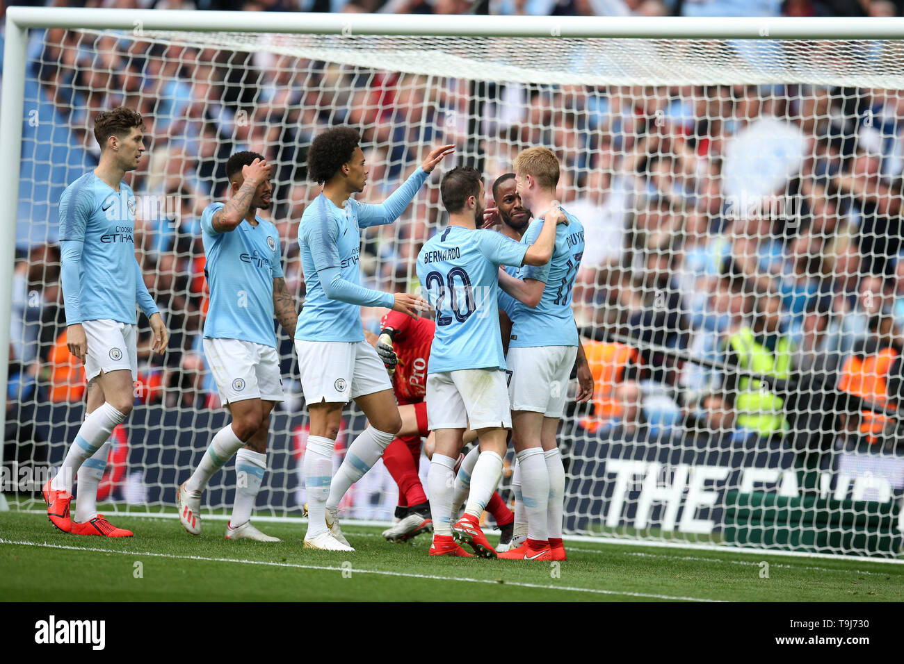 London, UK. 18th May, 2019. Raheem Sterling of Manchester city (centre) celebrates with teammates after scoring a goal. The Emirates FA Cup final, Manchester City v Watford at Wembley Stadium in London on Saturday 18th May 2019. this image may only be used for Editorial purposes. Editorial use only, license required for commercial use. No use in betting, games or a single club/league/player publications . pic by Andrew Orchard/Andrew Orchard sports photography/Alamy Live news Credit: Andrew Orchard sports photography/Alamy Live News Stock Photo