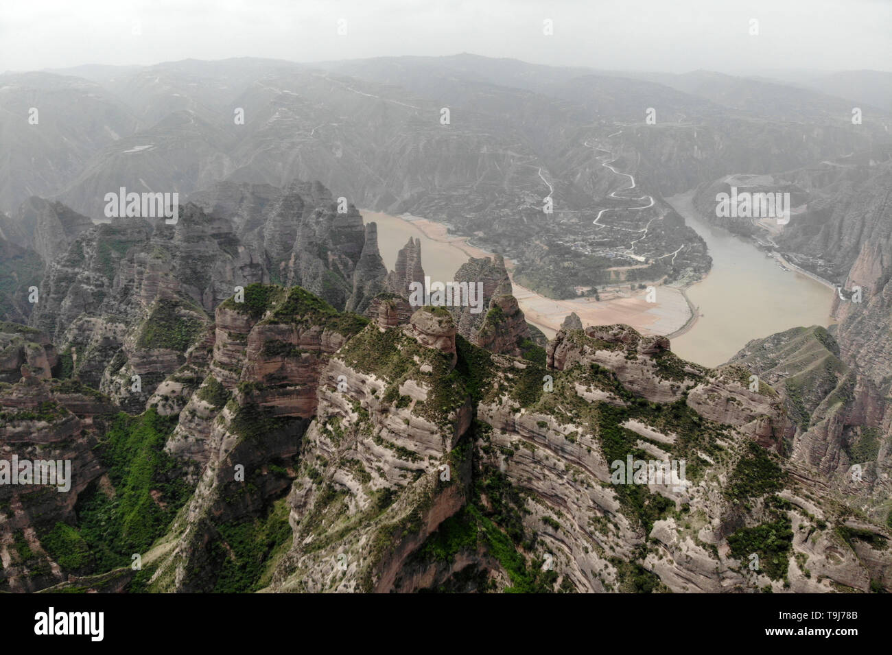 Yongjing. 19th May, 2019. Aerial photo taken on May 19, 2019 shows a stone forest at Bingling Danxia National Geological Park in Yongjing County, northwest China's Gansu Province. Danxia landform is a unique type of landscapes formed from red sandstone and characterized by steep cliffs. Credit: Fan Peishen/Xinhua/Alamy Live News Stock Photo