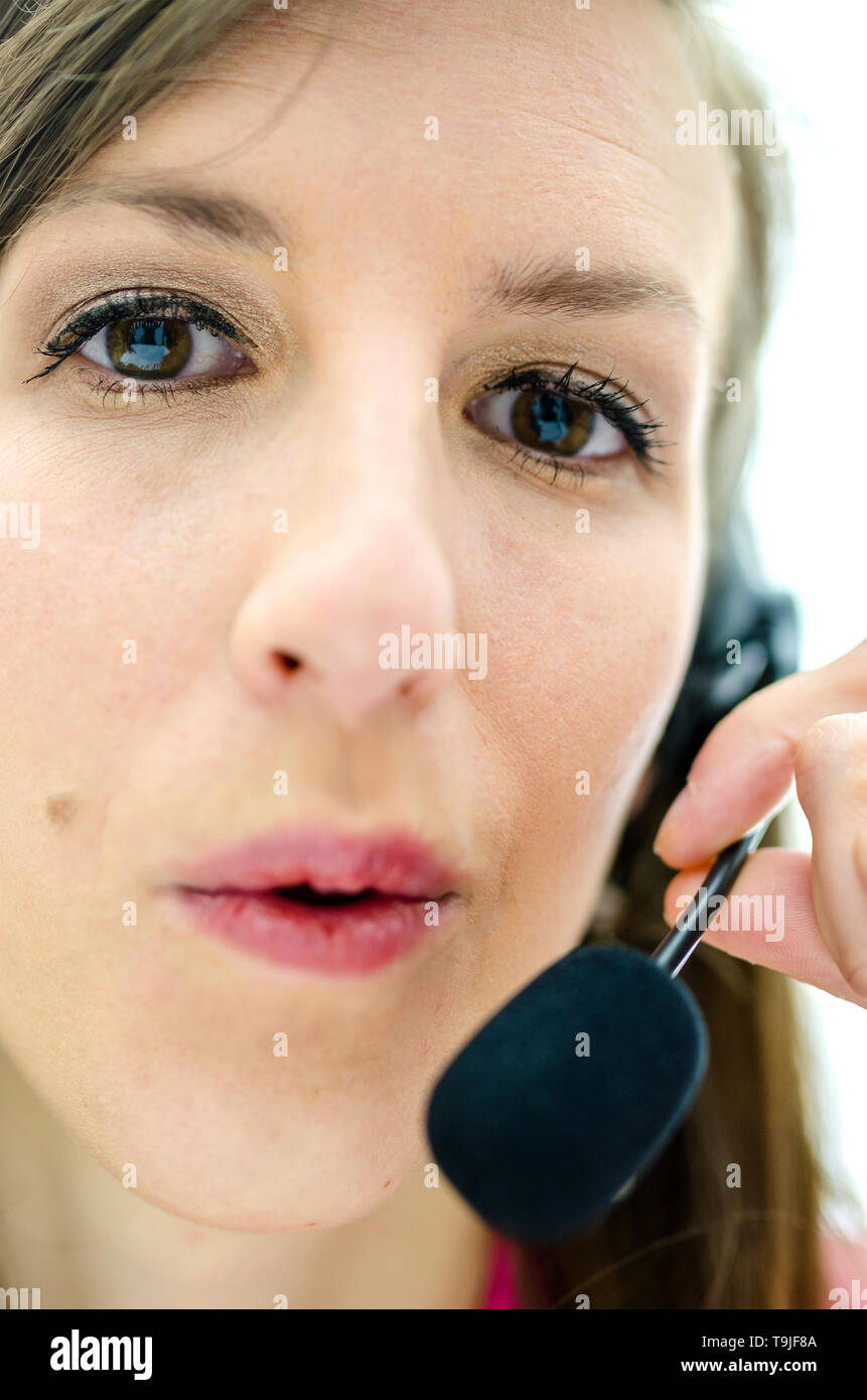Portrait of young businesswoman with headset Stock Photo - Alamy