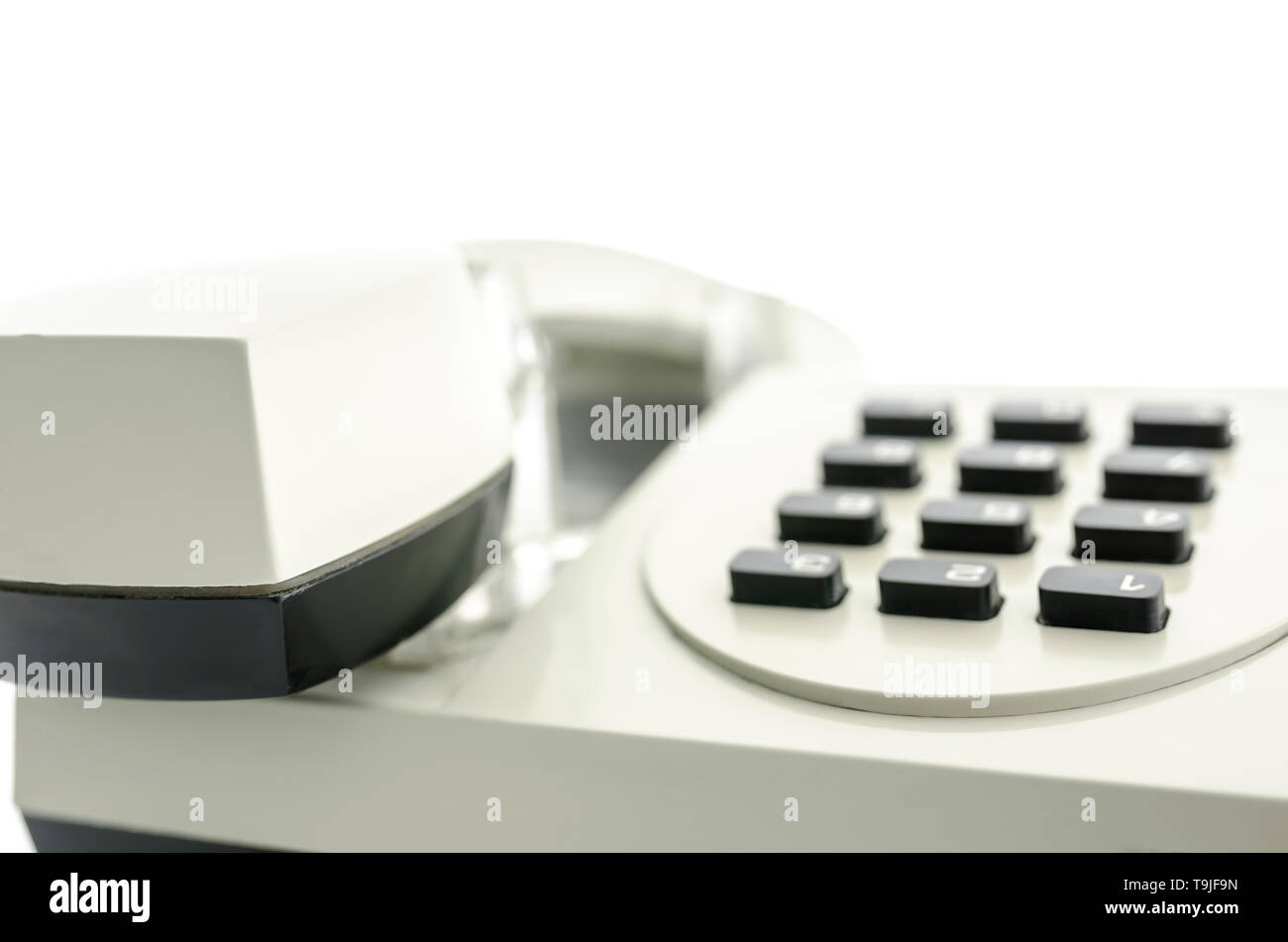 Front view of old telephone keypad and receiver. With copyspace Stock