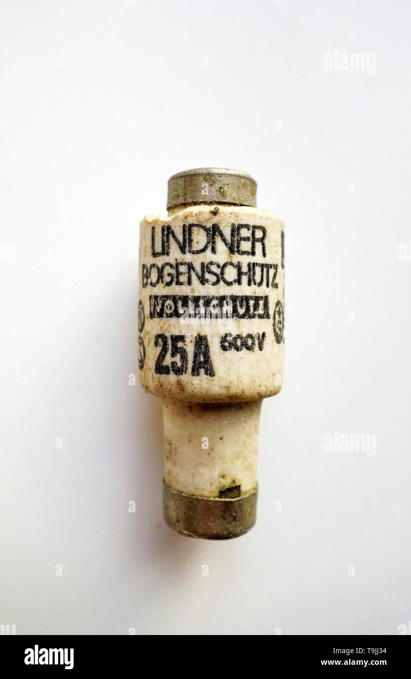 Old porcelain fuse on a white background Stock Photo