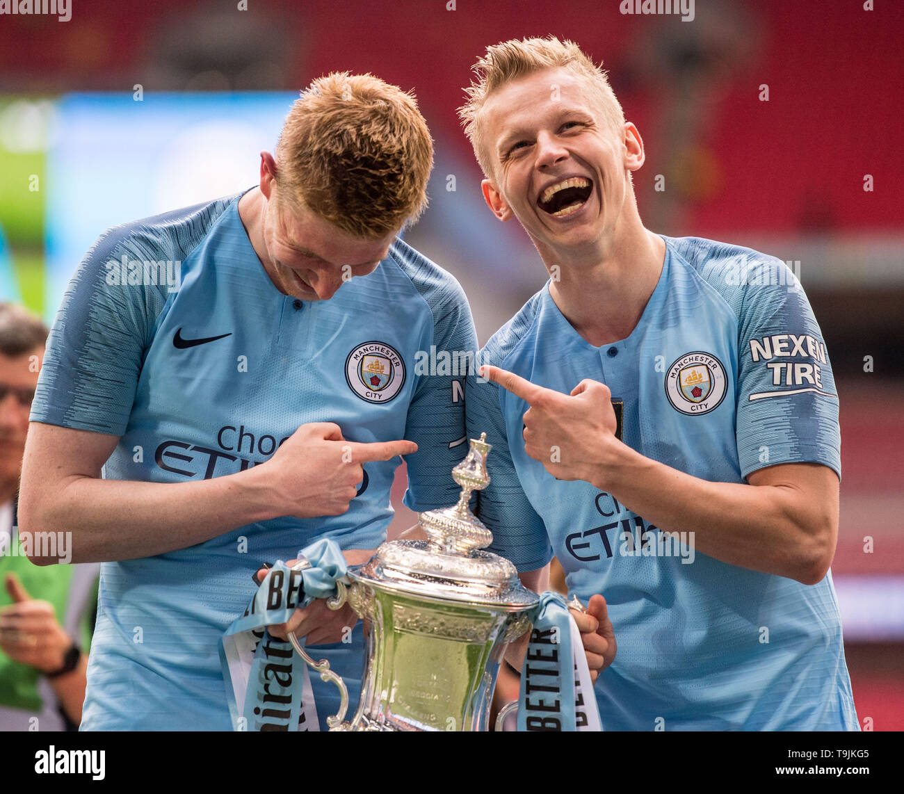 Manchester City's Oleksandr Zinchenko celebrates with the trophy