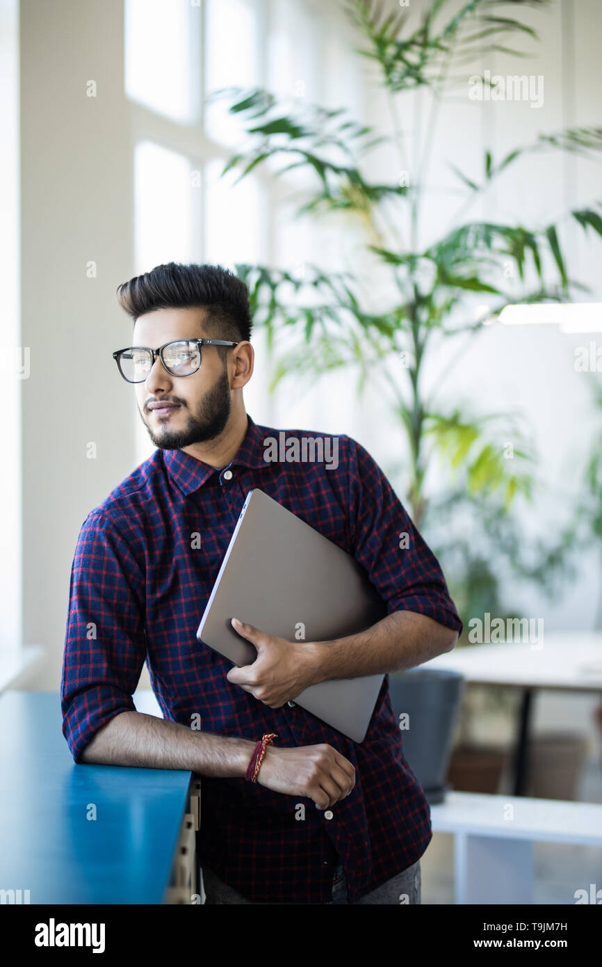 Indian man with laptop outdoor building hi-res stock photography and ...