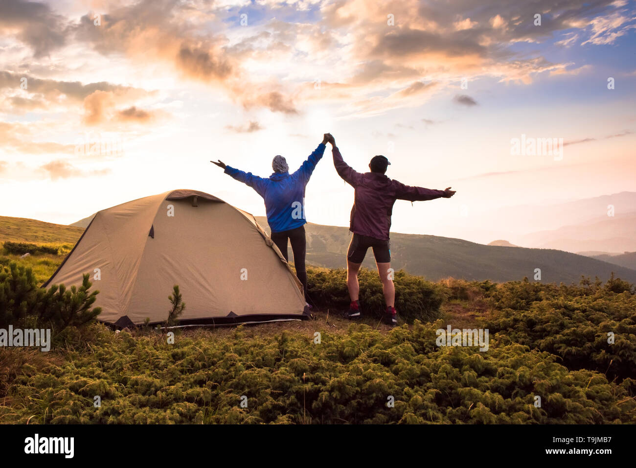 Camping and active couple on the top of high mountains. Success,  Achievement, Active life style. Tatras, Zakopane, Poland Stock Photo - Alamy