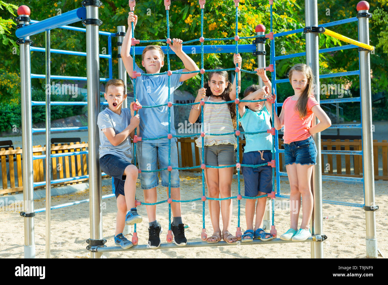 Happy children playing at playground outdoor Stock Photo - Alamy