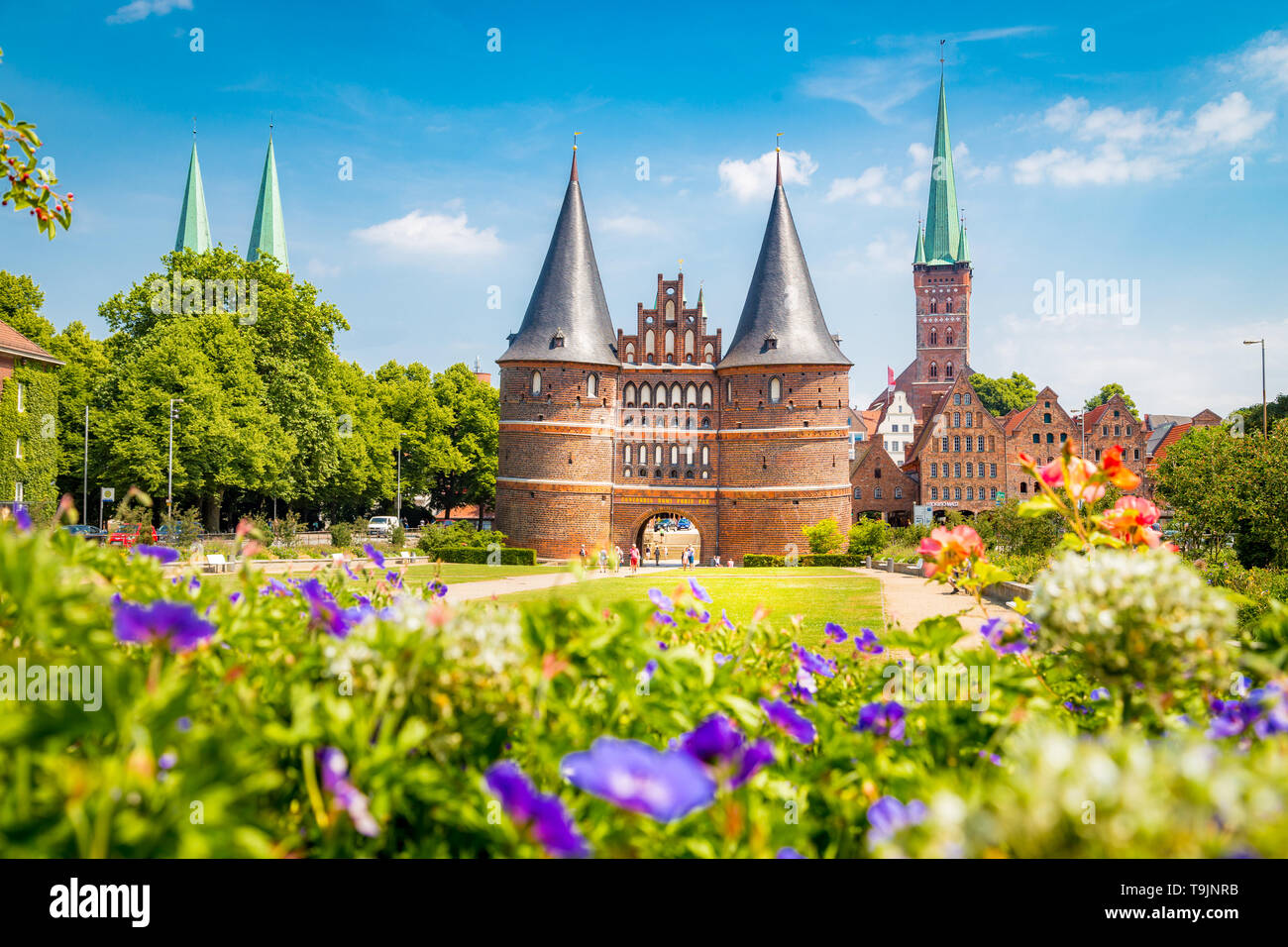 Classic postcard view of the historic town of Lübeck with famous Holstentor gate in summer, Schleswig-Holstein, northern Germany Stock Photo