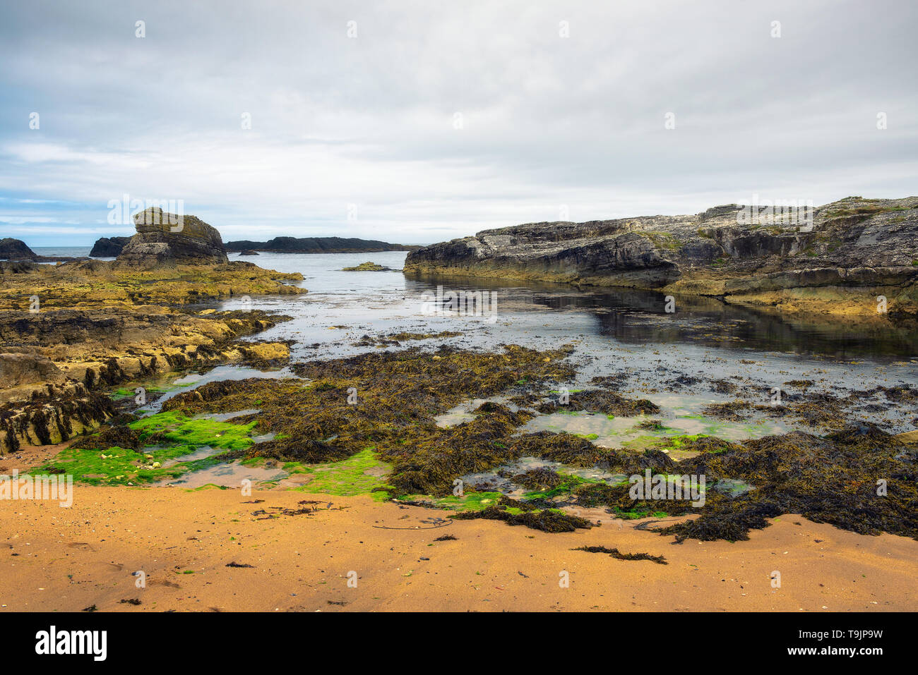 Dramatic landscape of the Ballintoy Harbor shoreline in Northern Ireland Stock Photo