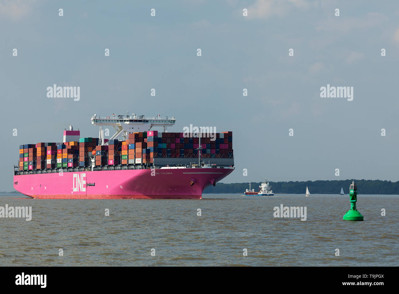 Stade, Germany - May 18, 2019: Ultra-large Container Ship ONE Columba on Elbe river heading to Hamburg. The vessel is operated by Ocean Network Express Stock Photo