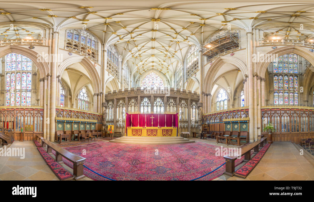 High altar and quire (choir) surrounded by stained glass windows in the medieval christian minster (cathedral) at York, England. Stock Photo