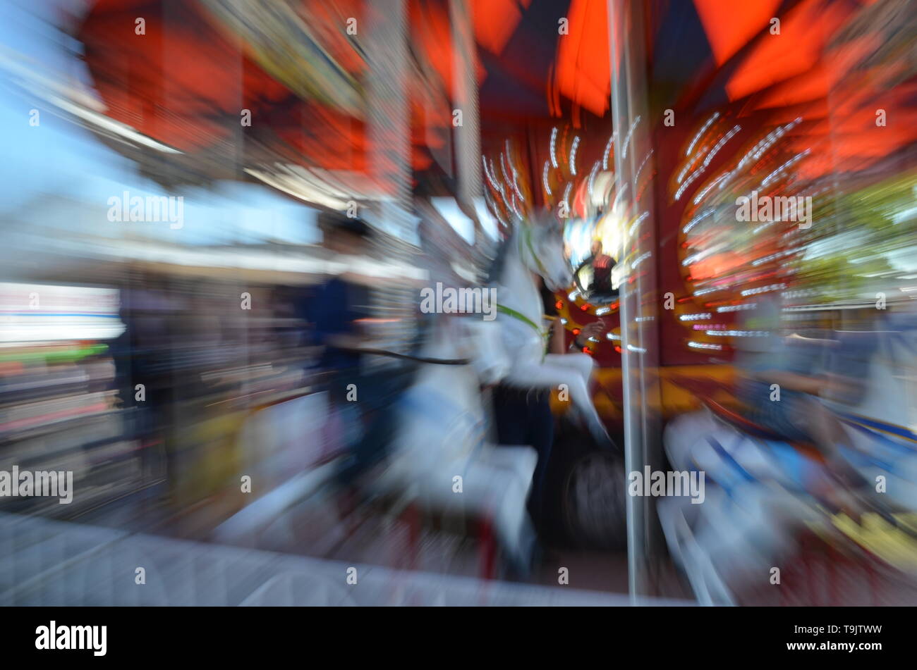 Riding the Merry-go-Round Stock Photo - Alamy