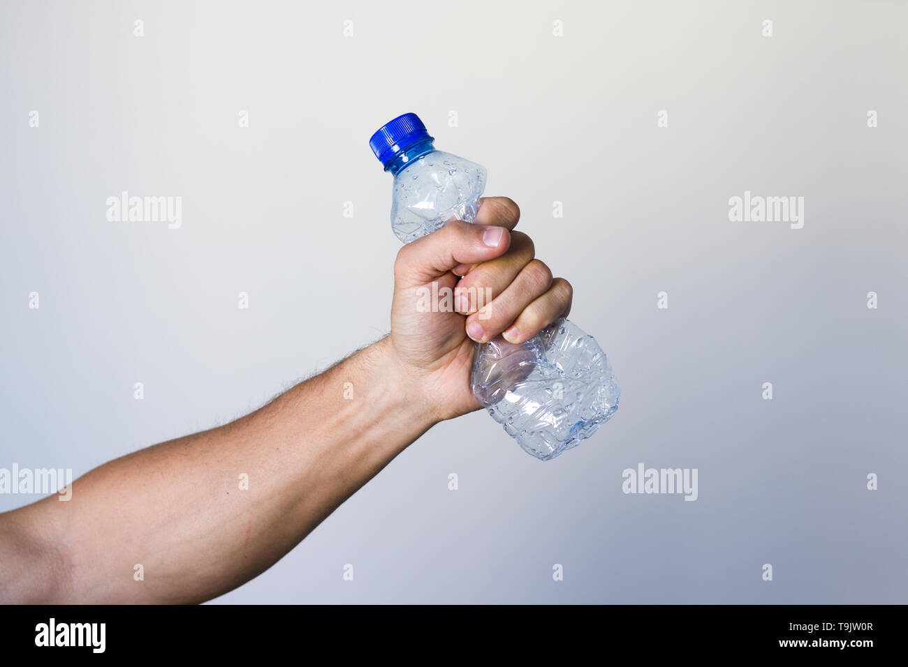 Man holding water bottle hi-res stock photography and images - Alamy