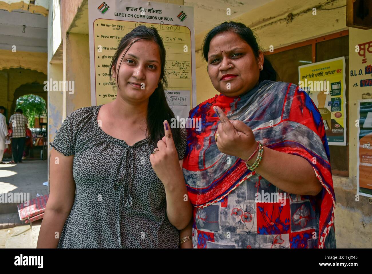 Indian voters seen showing their inked fingers after casting their vote