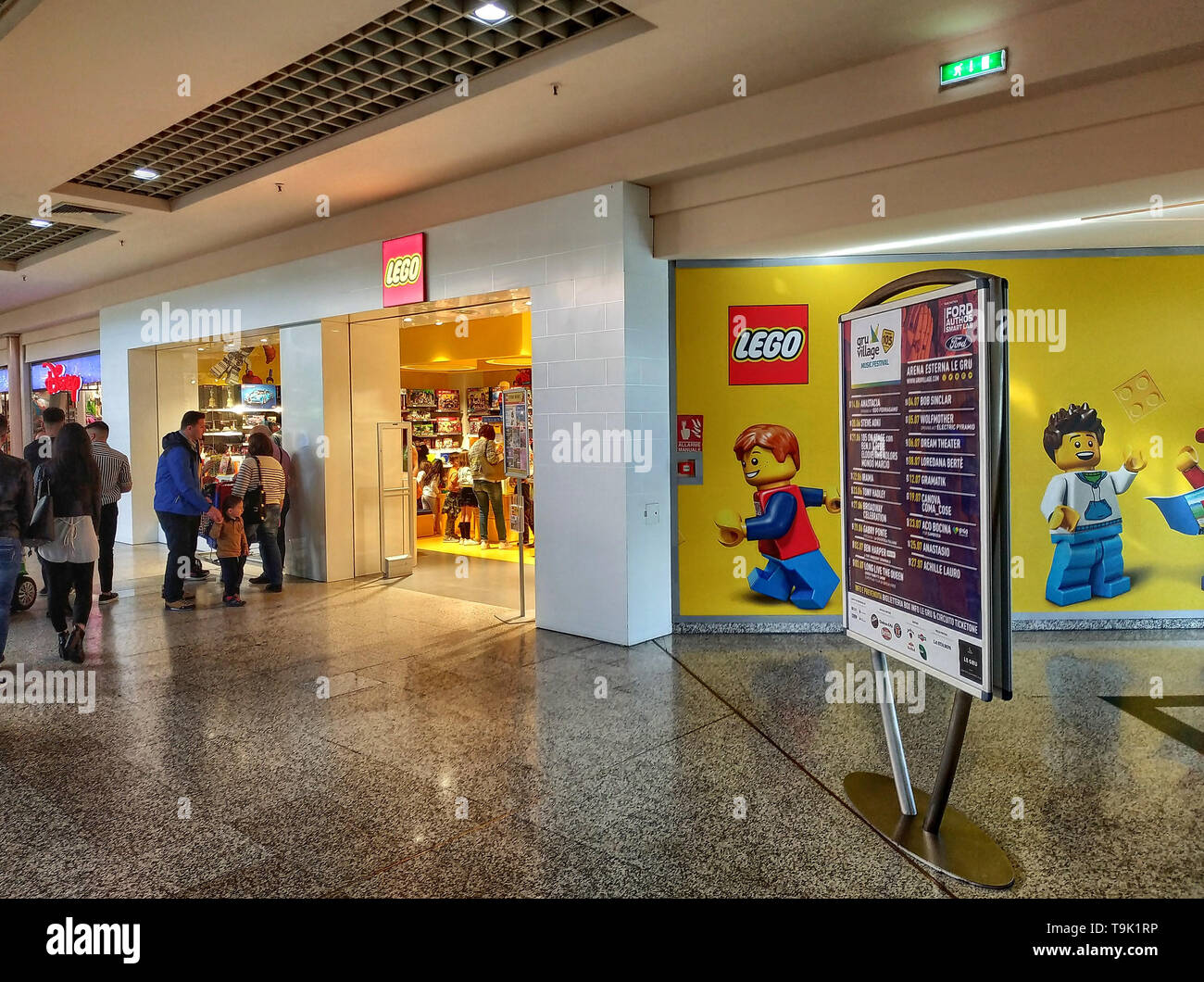Grugliasco, Piedmont, Italy. May 2019. The Lego store at a shopping mall. On the side of the shop, the logo and the characters drawn on the entire wal Stock Photo
