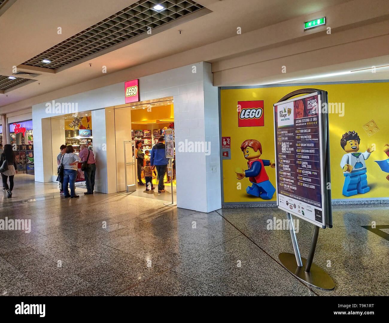 Grugliasco, Piedmont, Italy. May 2019. The Lego store at a shopping mall. On the side of the shop, the logo and the characters drawn on the entire wal Stock Photo