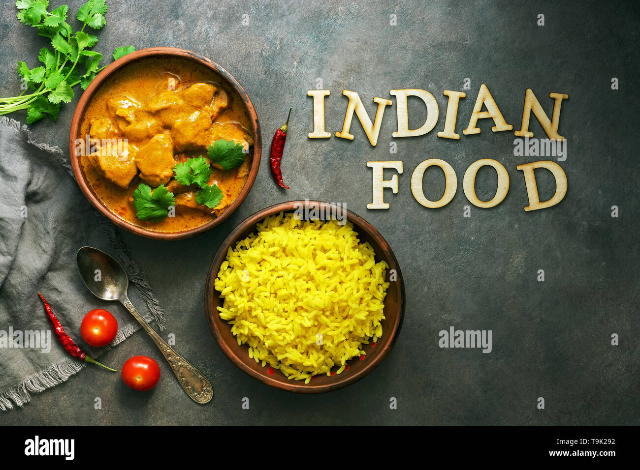 Indian Food Spicy Chicken Tikka Masala With Rice On A Dark Background Tex From Wooden Letters Indian Food Top View Flat Lay Stock Photo Alamy