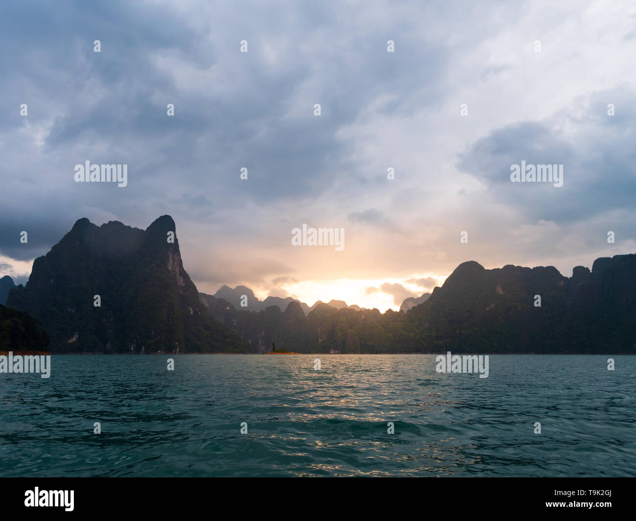 Scenic landscape of boat view in the big river and reservoir dam with mountain and nature forest Stock Photo