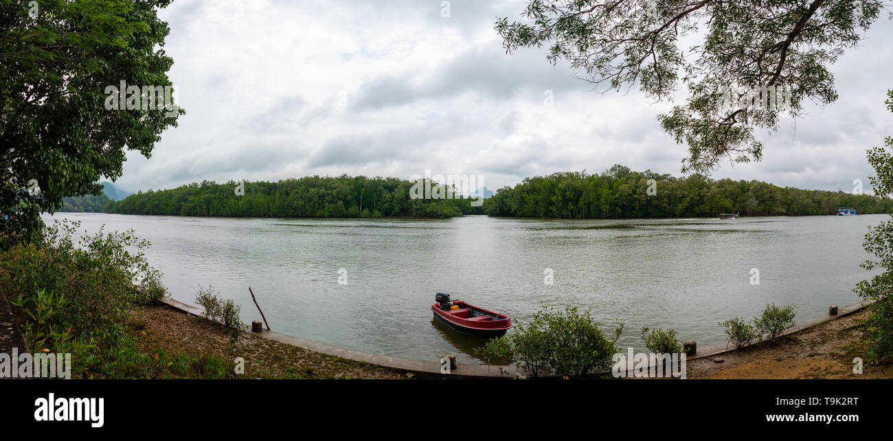 Scenic landscape of boat view in the big river and reservoir dam with mountain and nature forest Stock Photo