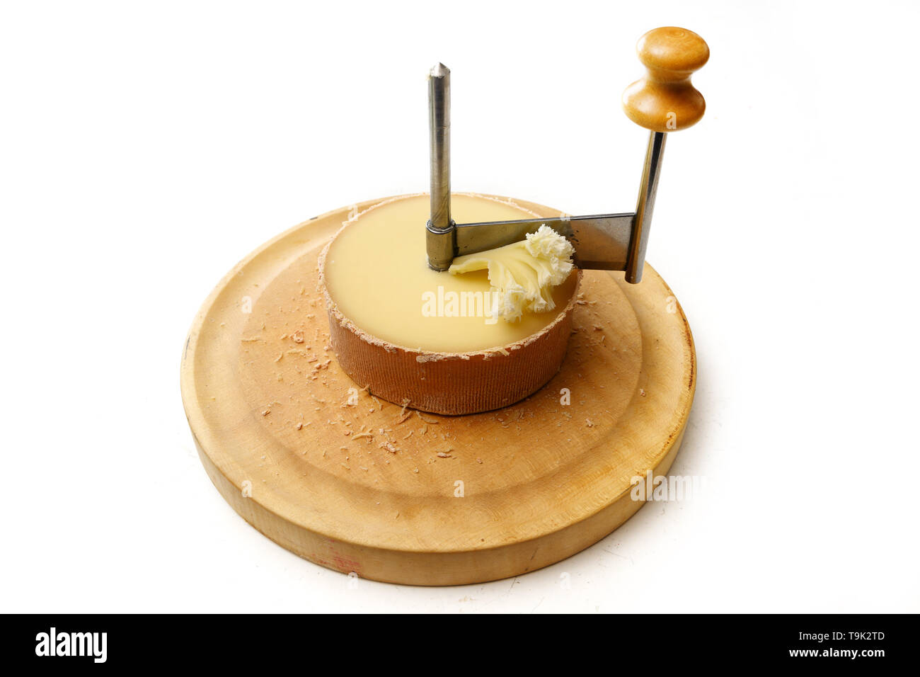 https://c8.alamy.com/comp/T9K2TD/tte-de-moine-or-monks-head-cheese-in-a-girolle-a-special-knife-to-cut-thin-shavings-in-form-of-rosettes-isolated-on-a-white-background-selected-f-T9K2TD.jpg