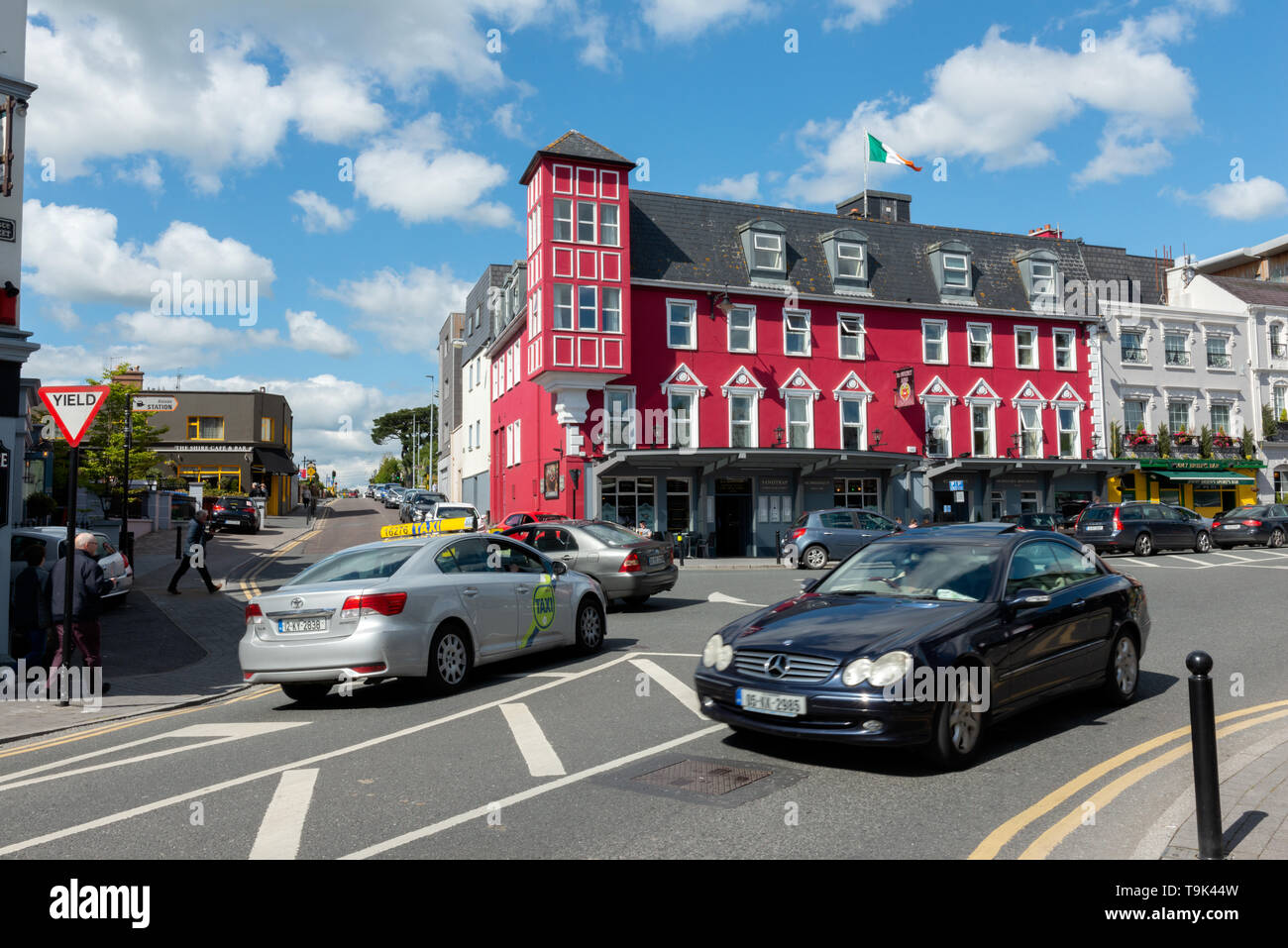 Cars on busy street and roundabout at the McSweeney Hotel in Killarney