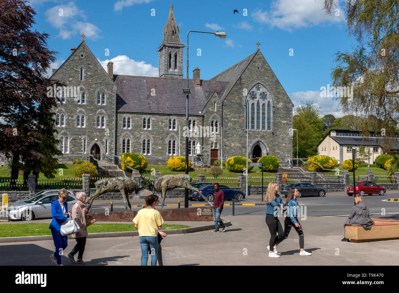 Killarney, people, iconic, sculpture, red deer stags, stags dueling, Church of the Irish Franciscans, Killarney Ireland, tourism, tourists, sunny Stock Photo