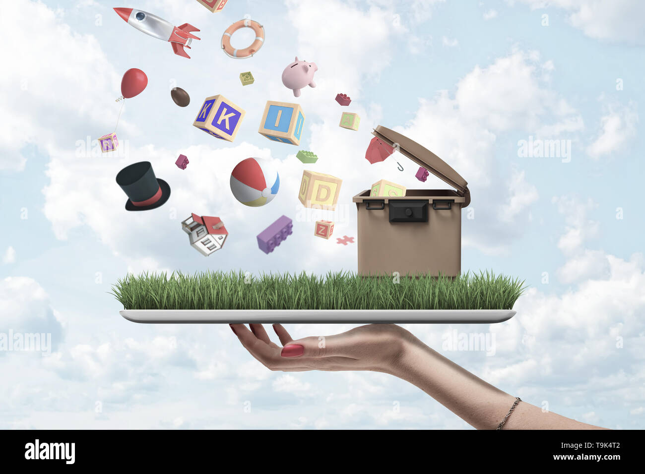 Side close-up of woman's hand holding digital tablet with green grass and trash can on screen and with misc objects falling from sky on to grass. Stock Photo