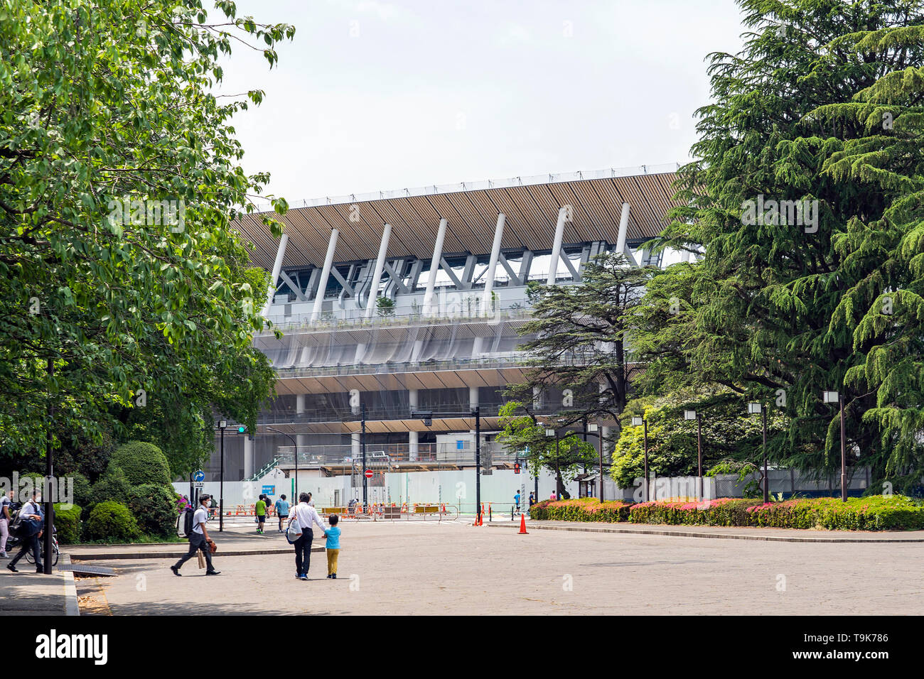 Few People Are Walking On A Square Around Construction Site Of New National Stadium In Tokyo. Japan Is Preparing For New Olympic Games. Stock Photo