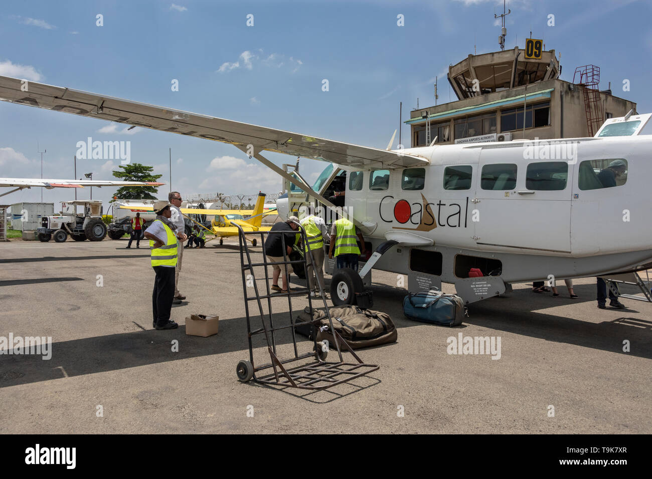 Coastal Air plane unloading at Arusha Airport, Tanzania Stock Photo