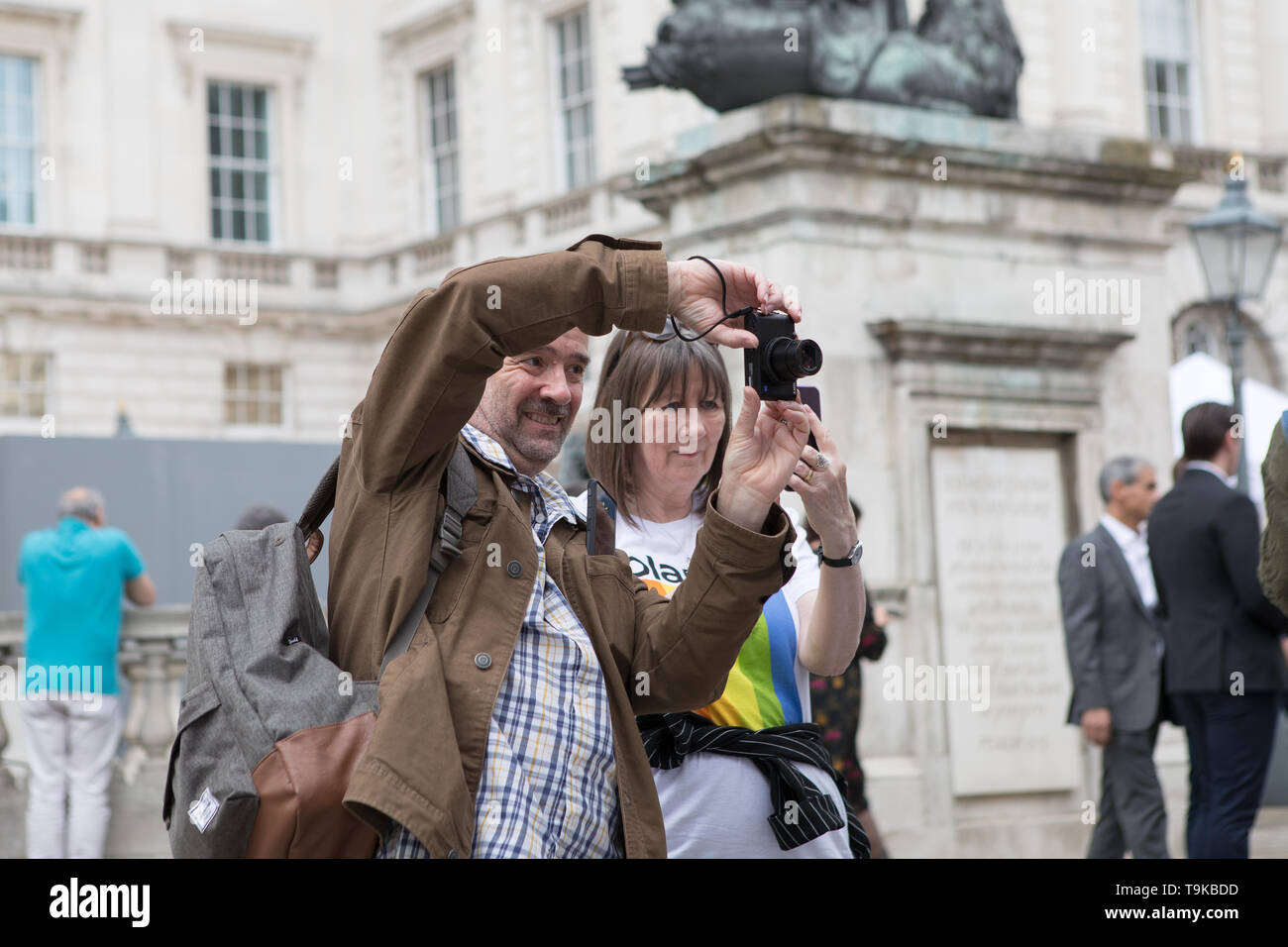London, UK. 18 May 2019. Crowds attend the fifth edition of Photo London at Somerset House. Over 100 galleries from 24 different countries showcase the work of past, present and future leading artists in photography. A Master of Photography exhibition dedicated to US photographer Stephen Shore.  An installation takes the theme of Women in Photography, celebrating the work of three established women photographers – Rachel L. Brown, Mary McCartney and Susan Meiselas. A discovery section focus on new and emerging talent. Stock Photo