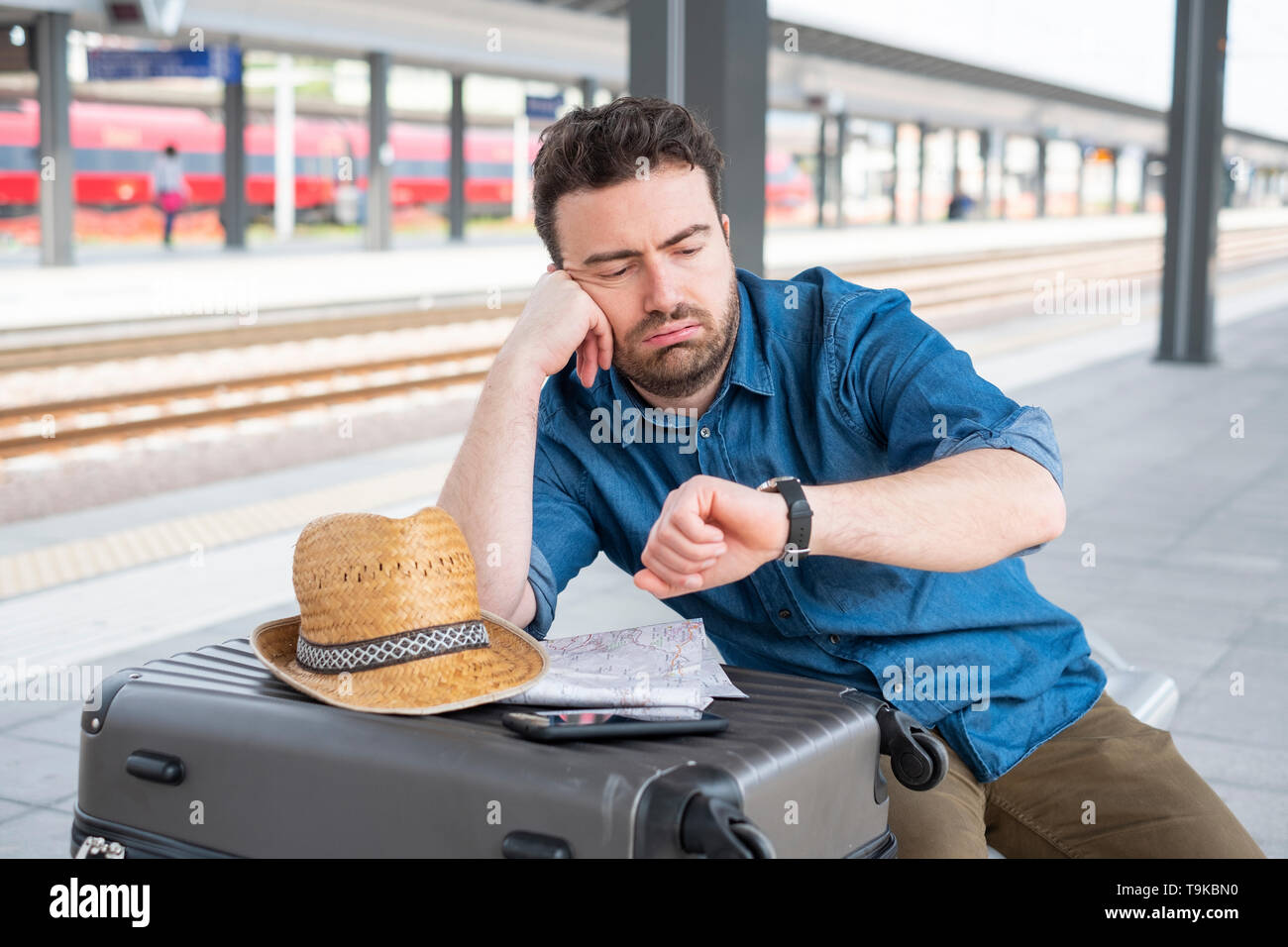 Man waiting for the train on railway station platform Stock Photo Alamy Man waiting for the train on railway station platform Stock Photo Alamy