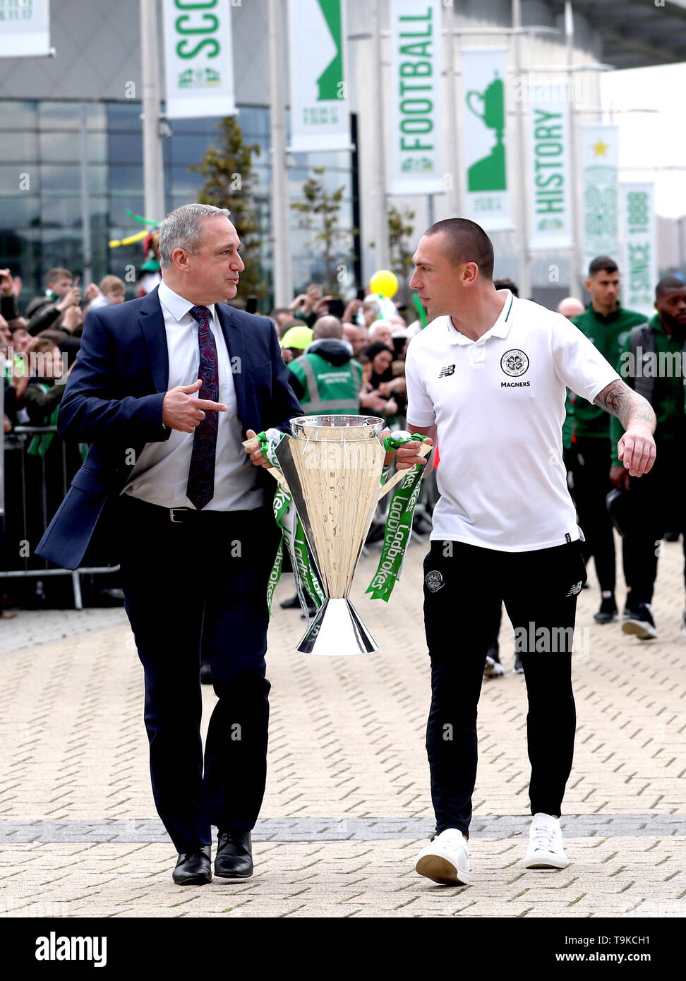 Former Celtic player Paul McStay (left) and Celtic's Scott Brown take the Ladbrokes Scottish Premiership cup trophy up to the stadium prior to the beginning of the Ladbrokes Scottish Premiership match at Celtic Park, Glasgow. Stock Photo