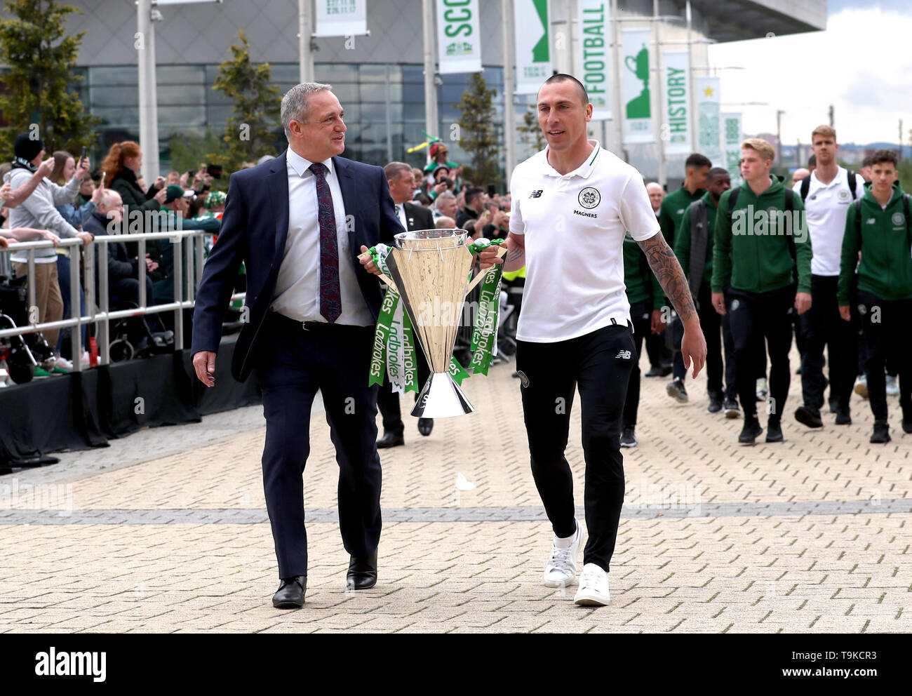 Former Celtic player Paul McStay (left) and Celtic's Scott Brown take the Ladbrokes Scottish Premiership cup trophy up to the stadium prior to the beginning of the Ladbrokes Scottish Premiership match at Celtic Park, Glasgow. Stock Photo