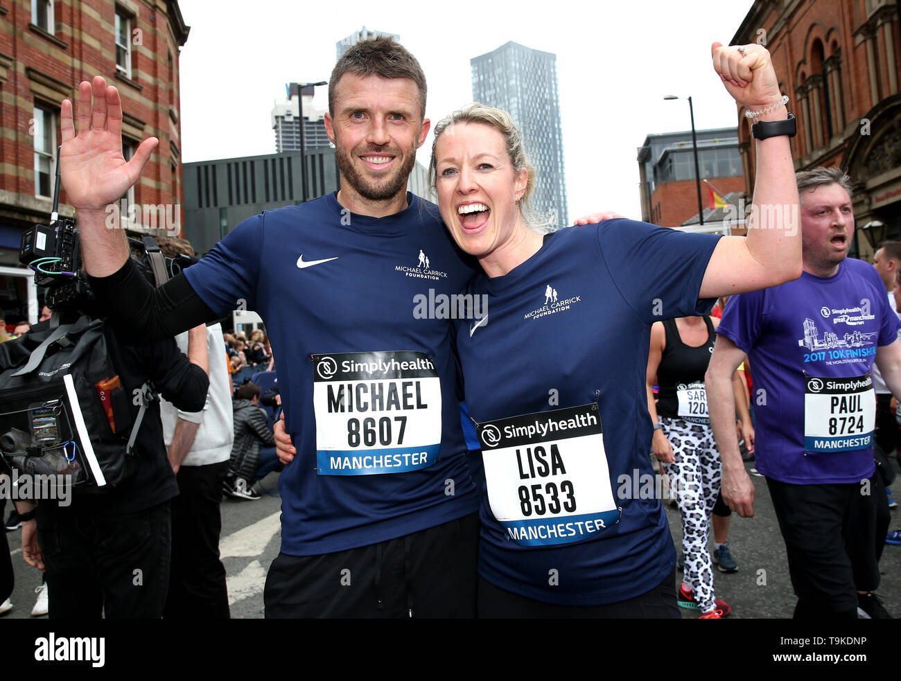 Michael Carrick and wife Lisa celebrate completing the Simply Health Manchester Run. Stock Photo