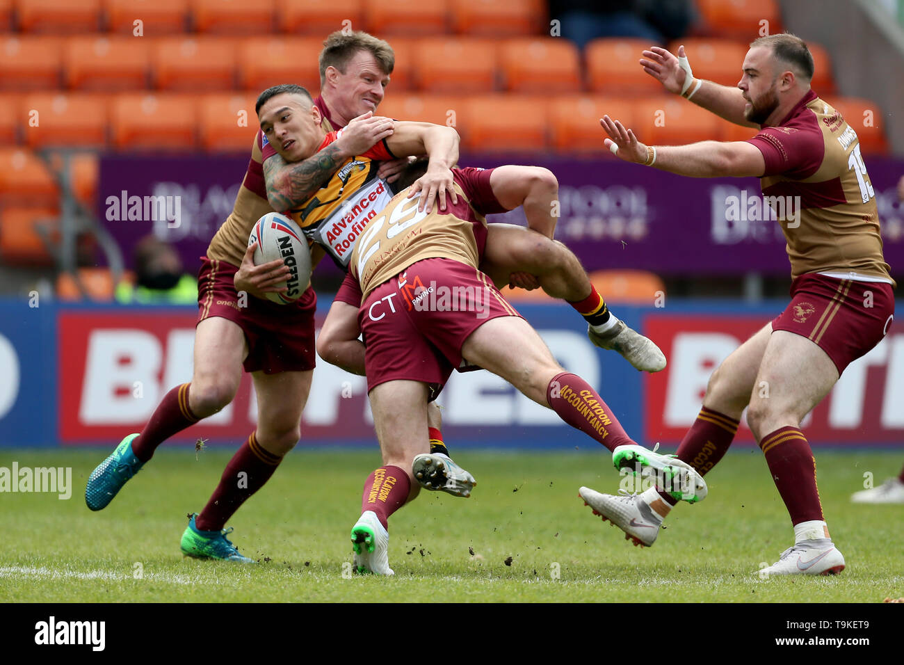 Barrow Raiders Tee Ritson is tackled by Sheffeld Eagles Ben Hellewell and Sheffeld Eagles Anthony Thackeray during the Betfred Championship Summer Bash match at Bloomfield Road, Blackpool. Stock Photo