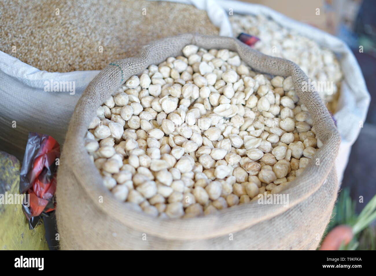Kemiri or Candlenut for sale at Traditional market in Indonesia Stock