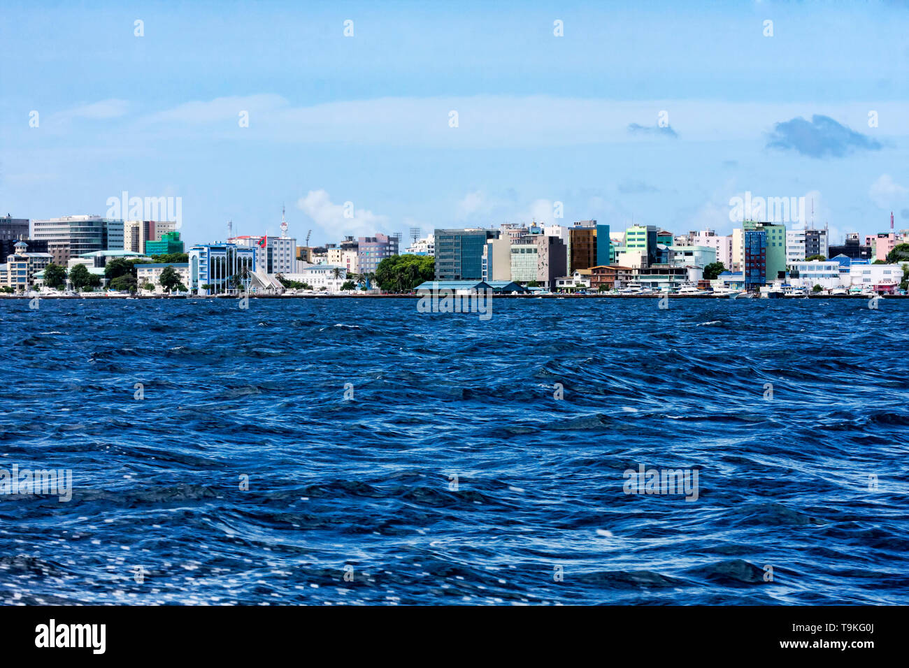 Beautiful tropical blue ocean and the skyline of Malé city in Maldives  islands shot from speedboat Stock Photo - Alamy