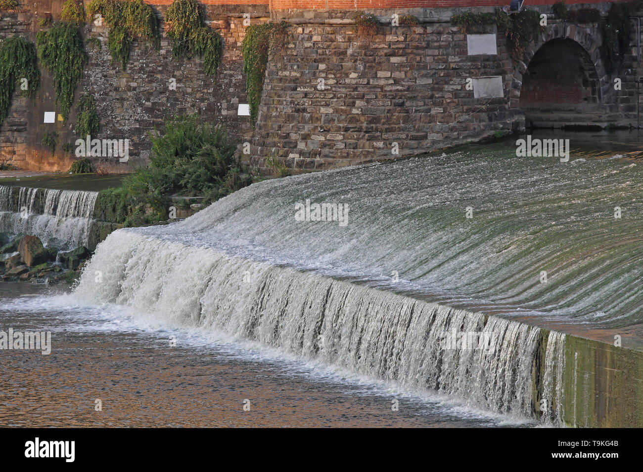 Arno River Cascade Waterfalls in Florence Italy Stock Photo - Alamy