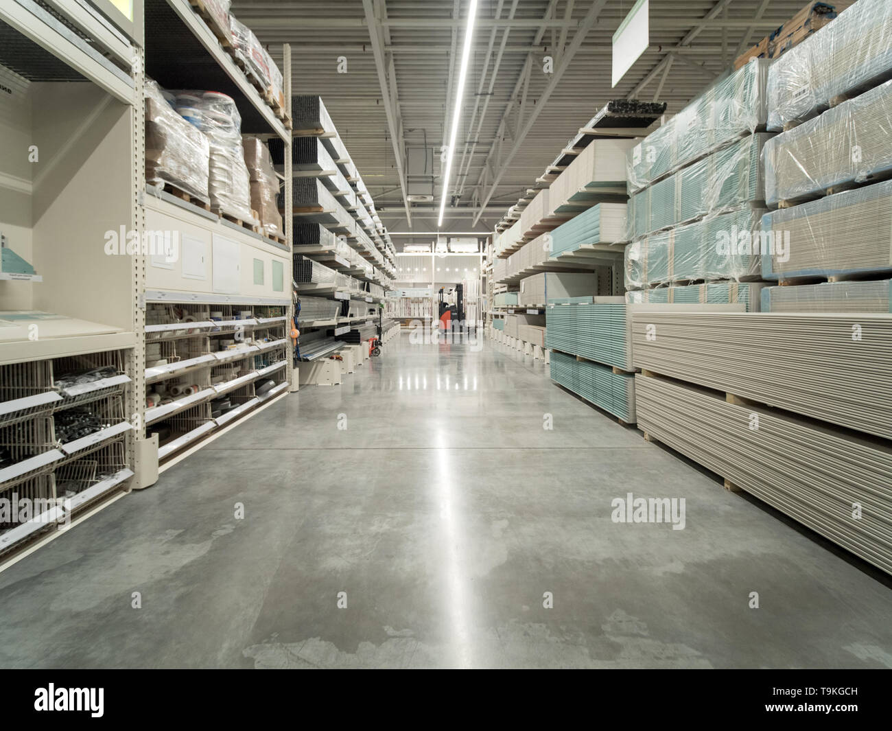 Store for home improvement and DIY. Warehouse aisle of building materials in industiral store. Shallow DOF Stock Photo