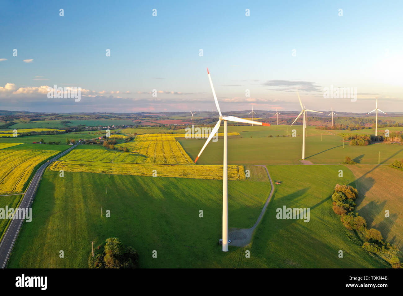 Wind turbines at sunset taken from the drone Stock Photo - Alamy