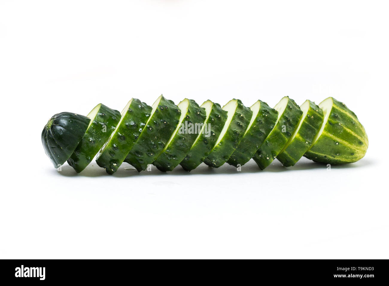 Sliced fresh green cucumber, slices on white background, isolate Stock Photo