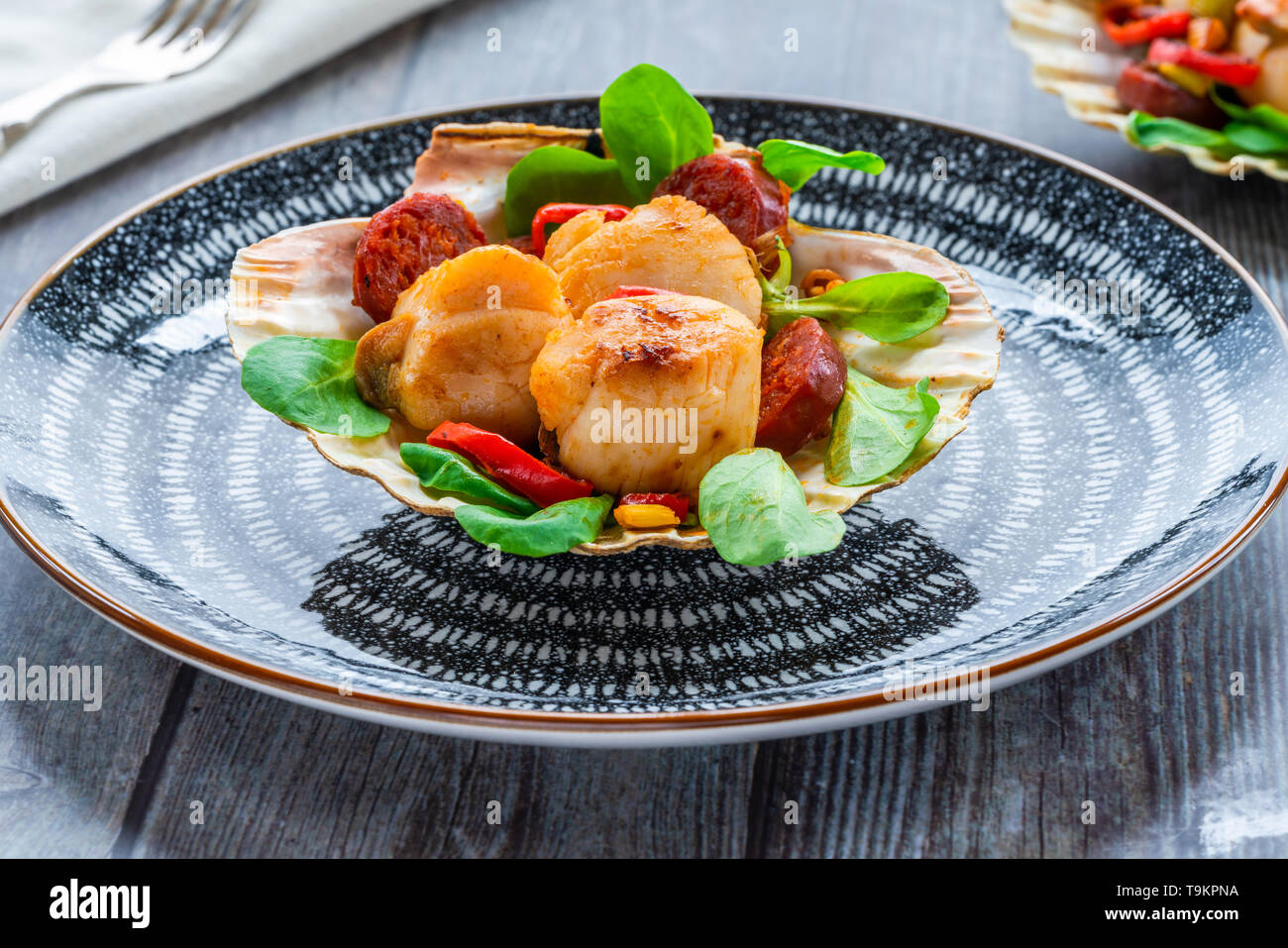 Spiced scallops with chorizo and chili in shell Stock Photo Alamy